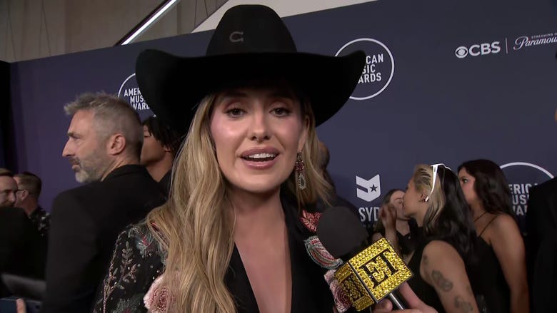 Lainey Wilson Jokes She Can Be ‘a Redneck Marvel Character’ in Cape at AMAs (Exclusive)